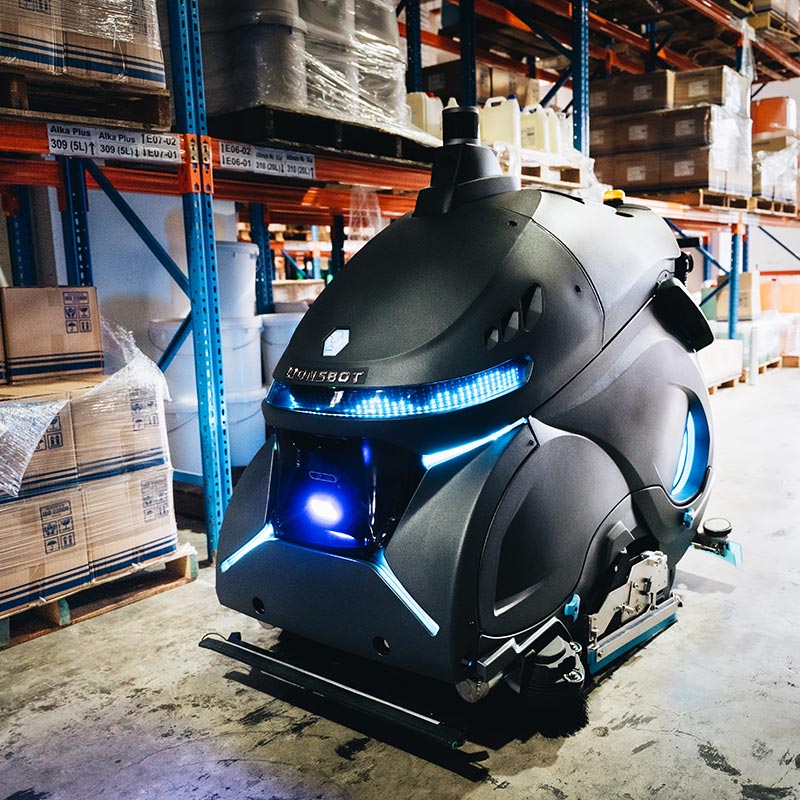 Le robot de nettoyage Rex nettoie dans un environnement logistique.